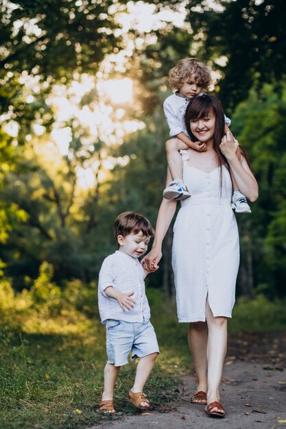 Mother with two sons in park