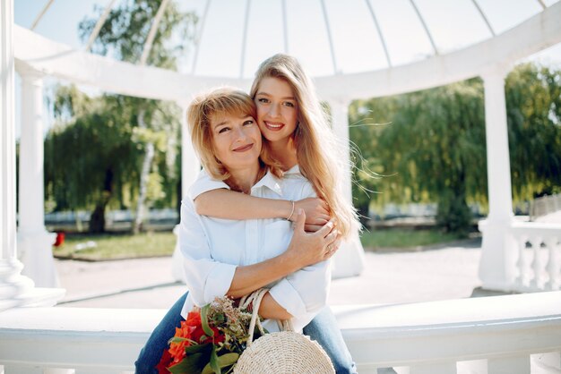 Mother with young daughter in a summer park