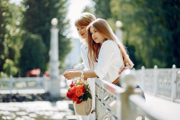 Mother with young daughter in a summer park