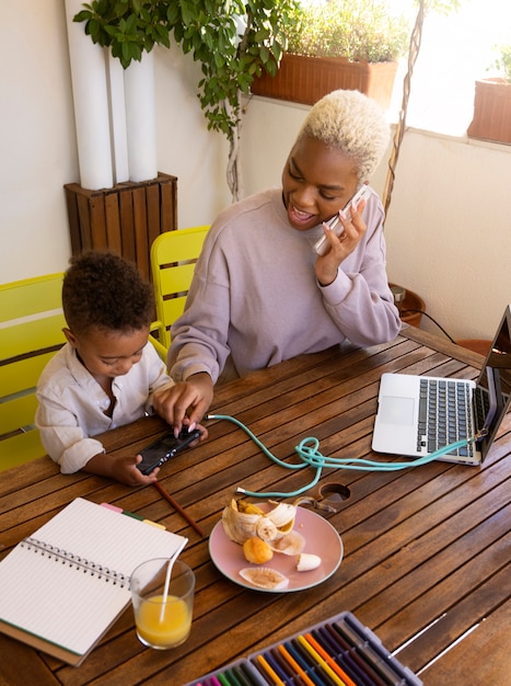 Mother working from home high angle