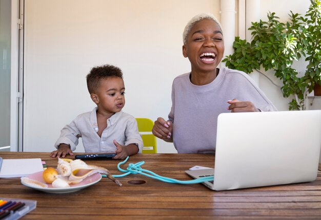 Mother working from home medium shot