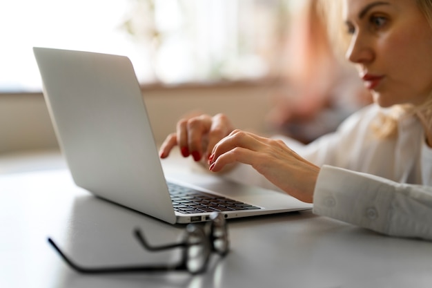 Free photo mother working from home trying to balance family life with child and job