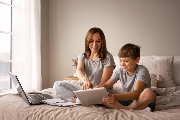 Mother working remote full shot