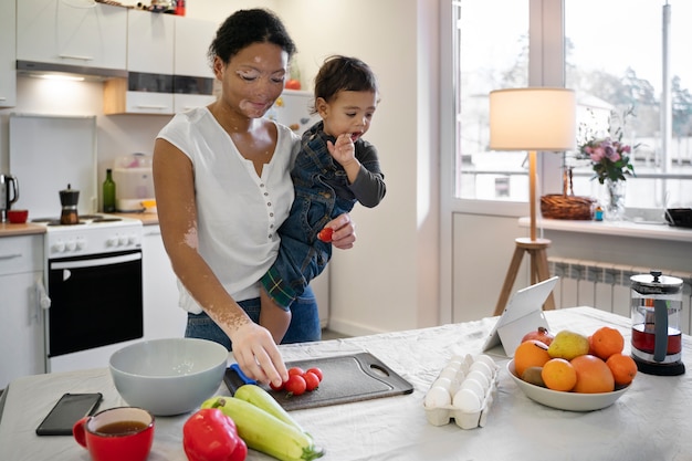 Mother working while spending time with  her kid