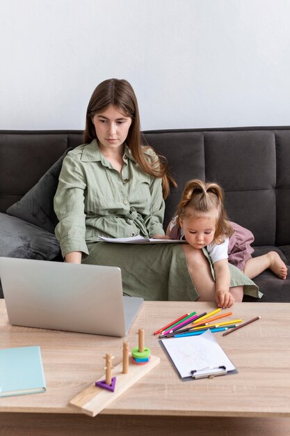 Mother working with little girl