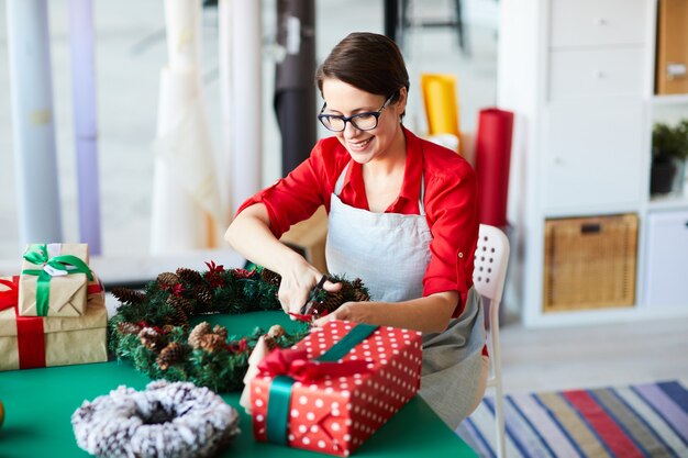 Mother wrapping Christmas presents