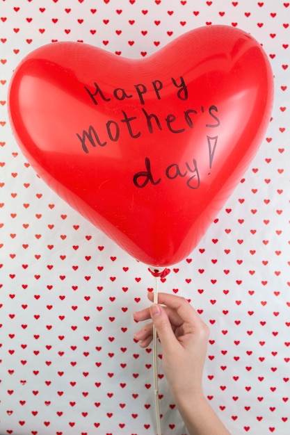 Mothers day background with heart balloon