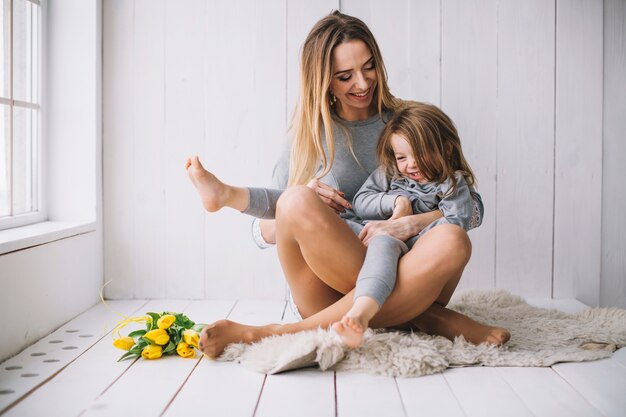 Mothers day concept with mother and daughter playing