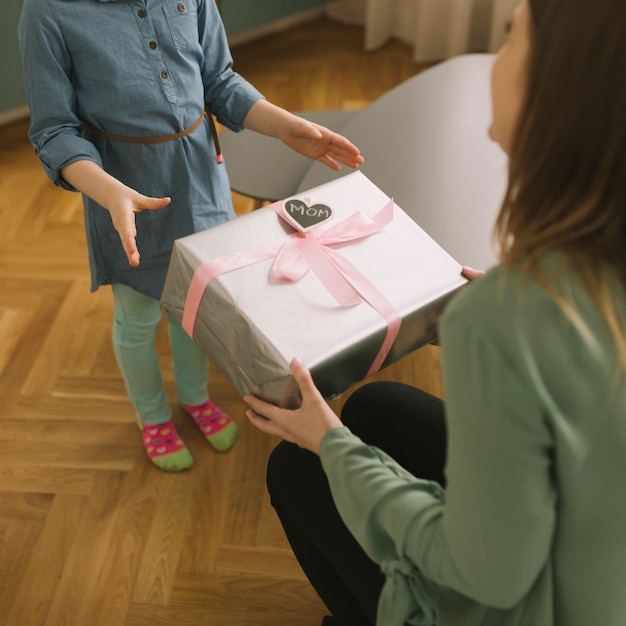 Mothers day concept with mother receiving present