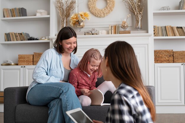 mothers spending time together with their daughter at home
