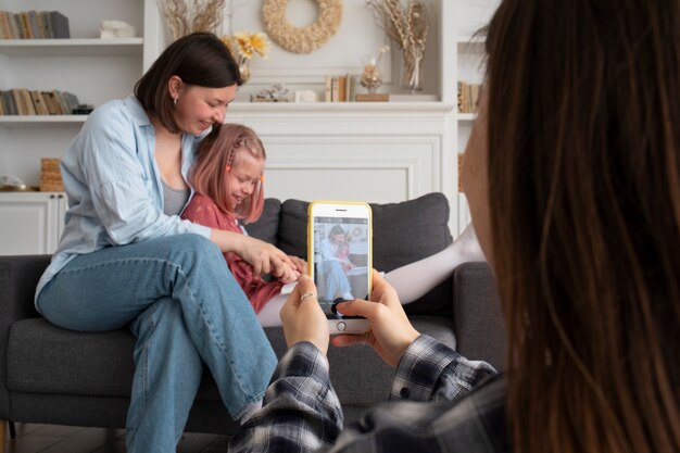 Mothers spending time together with their daughter at home