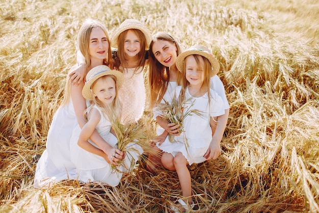 Mothers with daughters playing in an autumn field