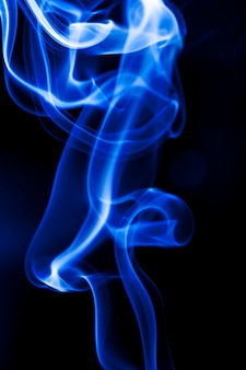 Motion blue smoke on black background. Premium Photo