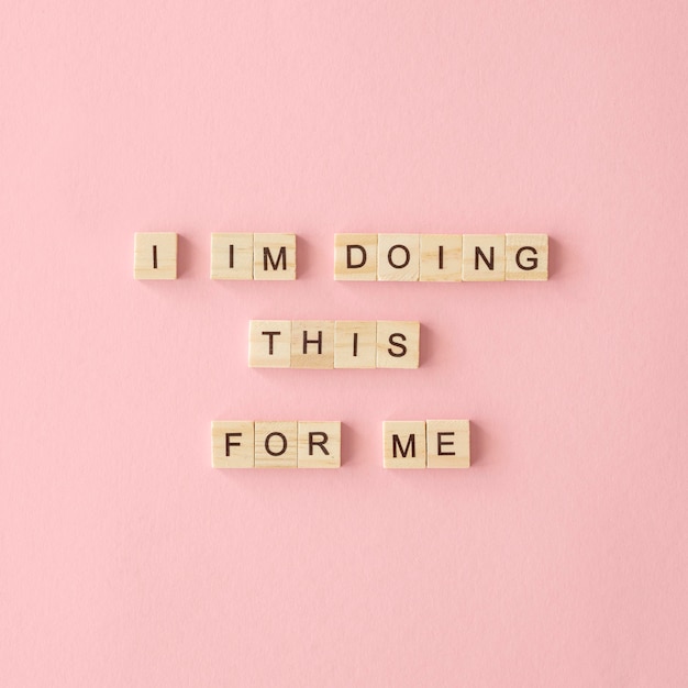 Motivational text on pink background
