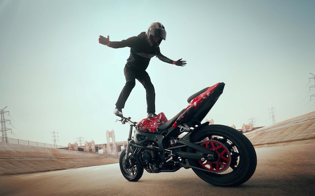 Foto gratuita motociclista che fa un'acrobazia sulla sua moto motociclista che fa un'acrobazia difficile e pericolosa