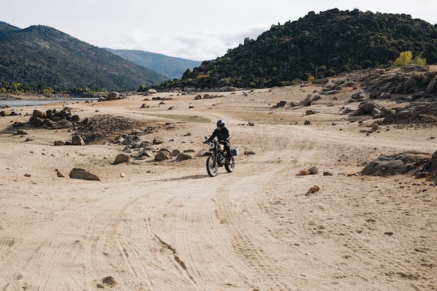 Motorcycle rider on offroad gravel track