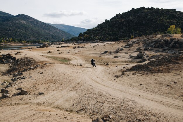 Motorcycle rider on offroad gravel track