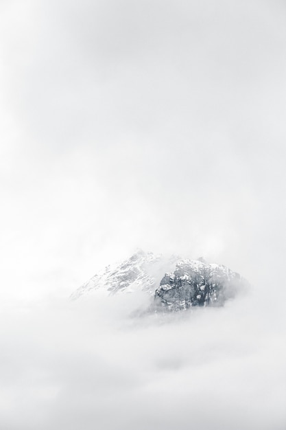 Free photo mountain covered with fog