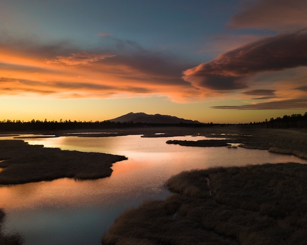 A mountainous landscape with the majestic Arizona Snowball located in Flagstaff at sunset