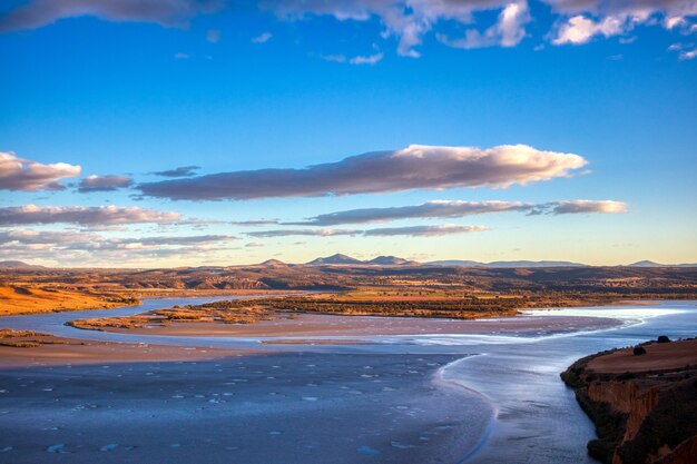 Mountains gleaming under the beautiful blue cloudy sky