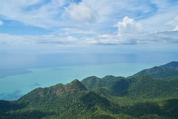 Mountains seen from above with the sea next to it