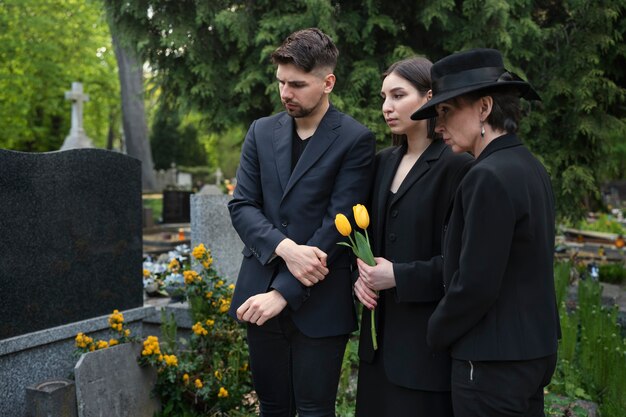 Mourning family together at the cemetery