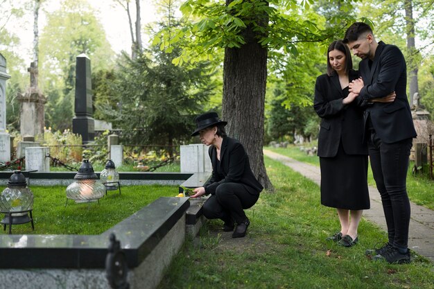 Mourning family together at the cemetery