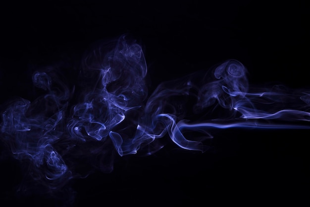 Free photo movement of purple smoke abstract on black background