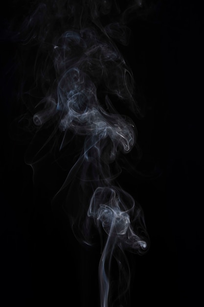 Movement of white smoke on black background