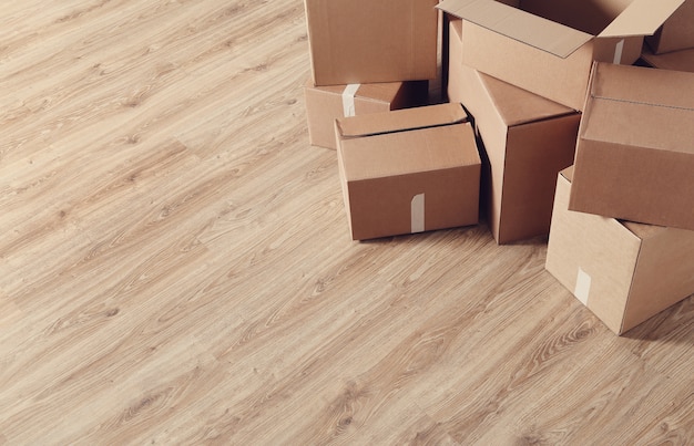 Free photo moving home with cardboard boxes