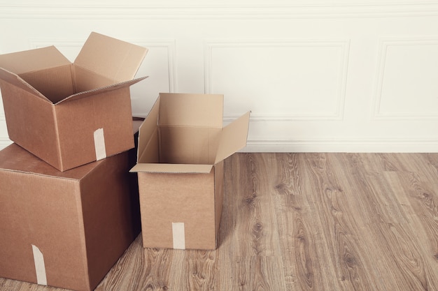 Free photo moving home with cardboard boxes