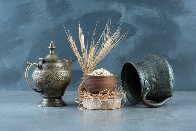 Muesli grains in a wooden cup on blue background. High quality photo