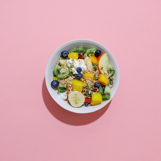 Muesli with fruits served in bowl