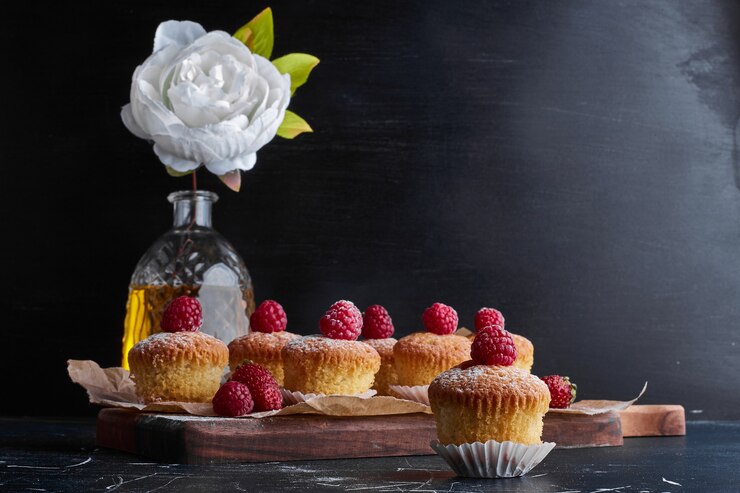 Free Photo muffin tops with raspberries. 