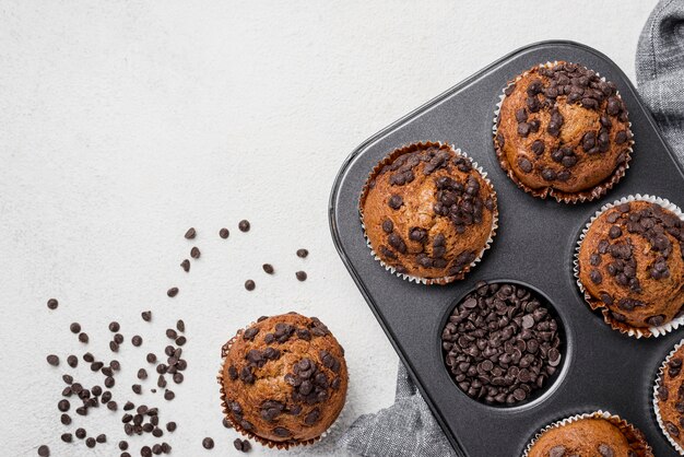 Muffins on baking tray and chocolate chips