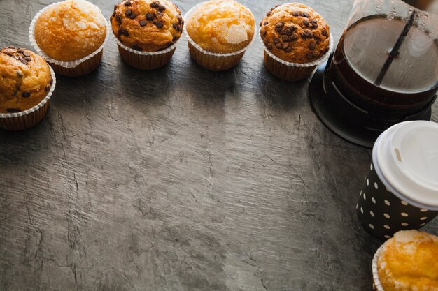 Muffins and coffee on table