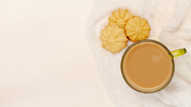 Mug of coffee with cookies