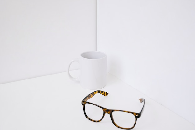 Mug next to glasses