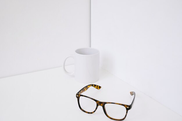 Mug next to glasses