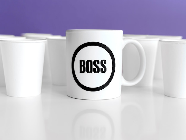 Mug with boss text on table