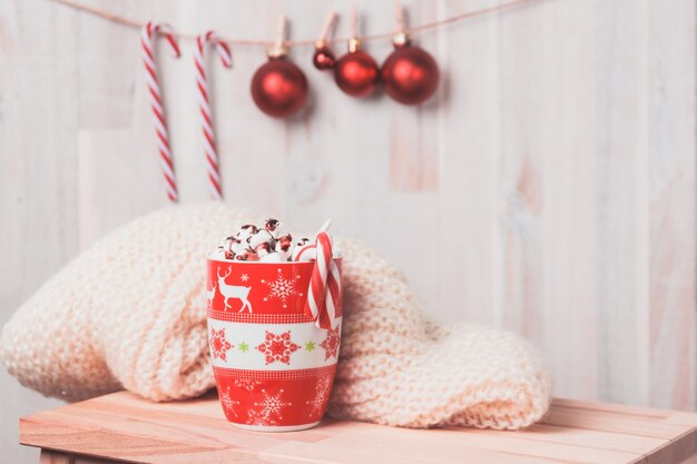 Mug with marshmallows and christmas balls