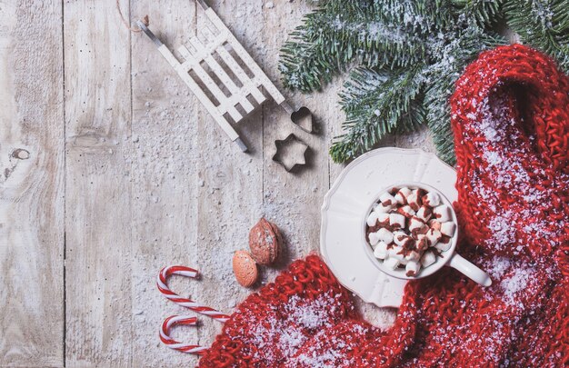 Mug with marshmallows and christmas decorations