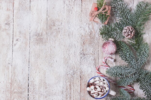 Mug with marshmallows and christmas decorations