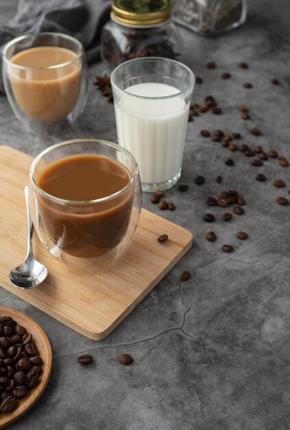 Mugs with coffee on table