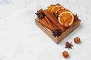 Free photo mulled wine spices in wooden box on table