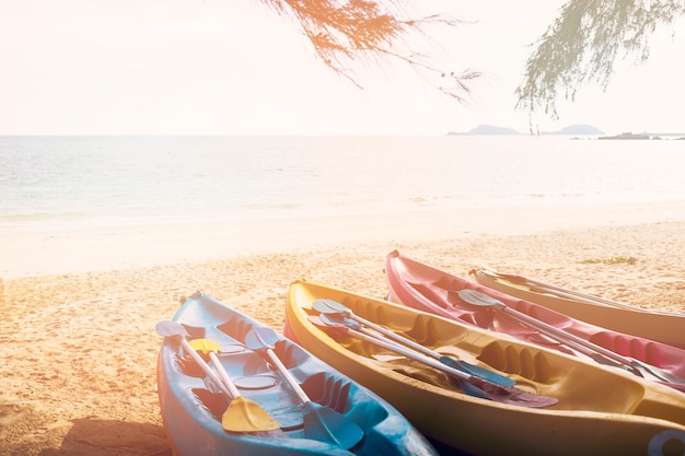 Multi colored canoe's on beach