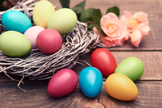 Multi colored eggs on the brown planks