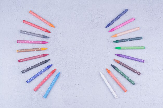 Multicolor crayons or pencils in geometric composition