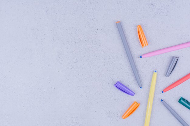Multicolor mandala craft pencils isolated on grey surface