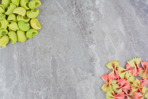 Multicolor pastas isolated on grey marble